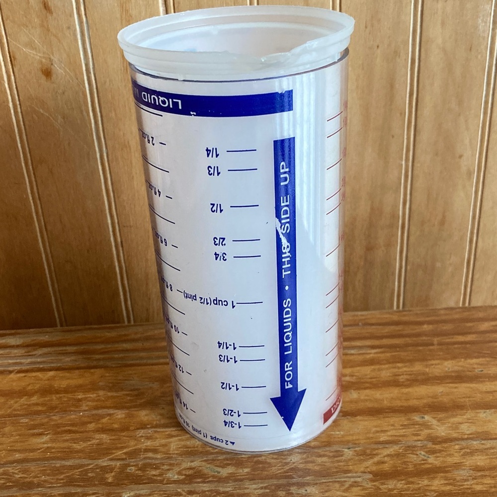 The Pampered Chef Clear Measuring Cup with Blue and Red Markings
